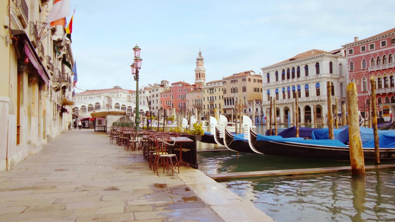 Venice Grand Canal shore and gondolas on the water