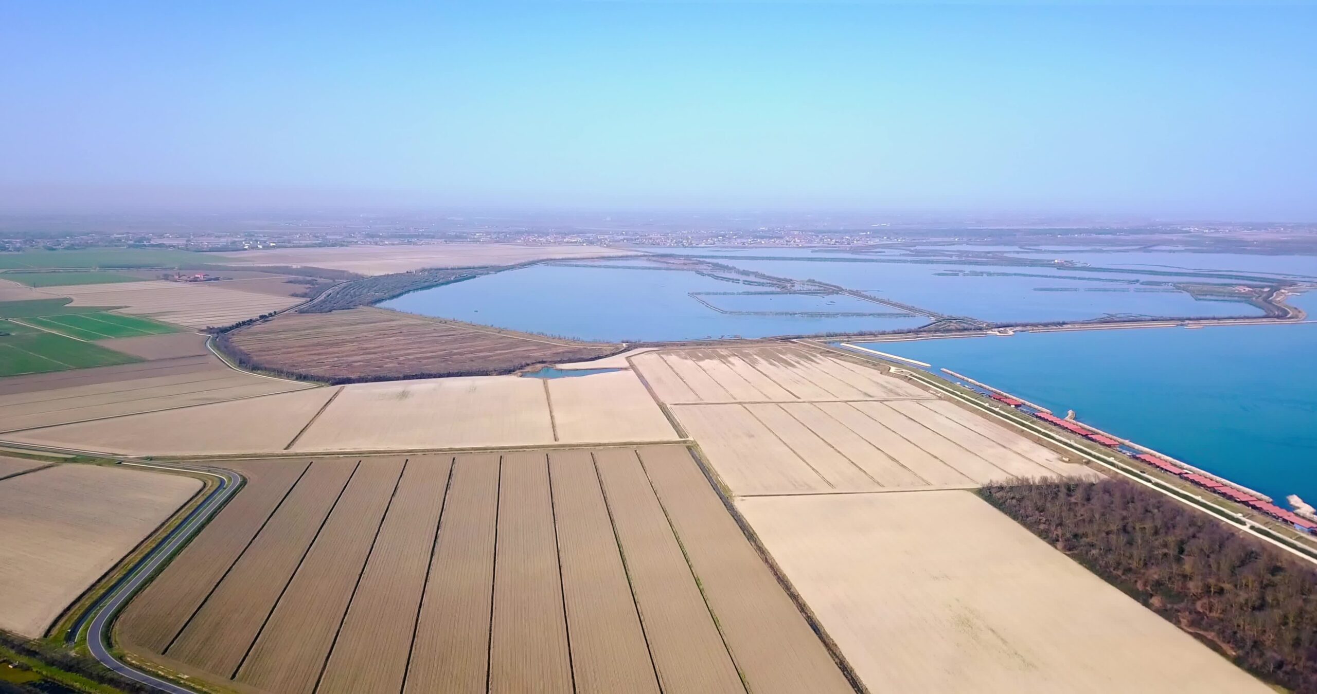 Plowed unseeded fields with perfect vertical lines by water