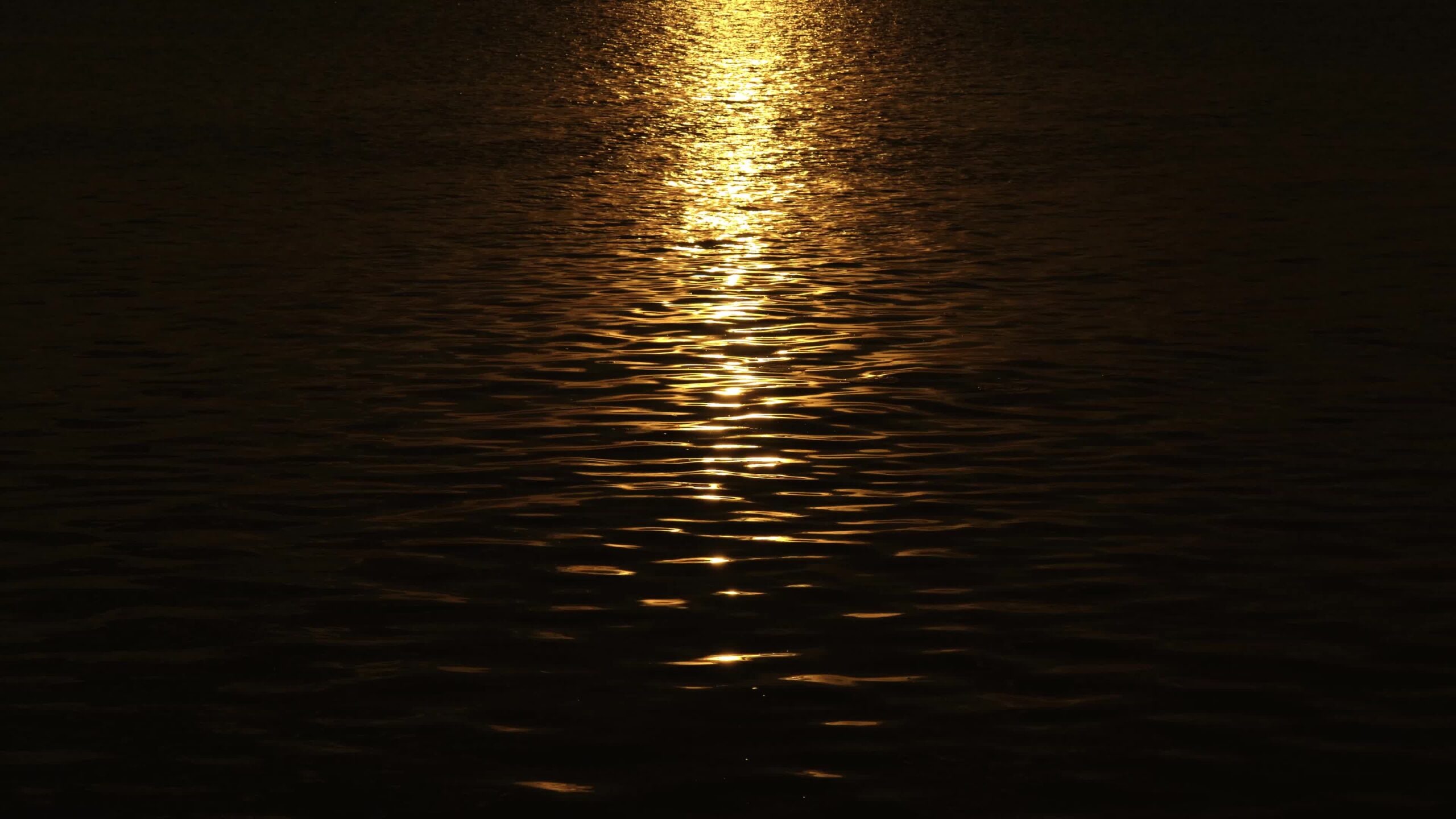 Shining sunlight reflection on water in Venetian lagoon