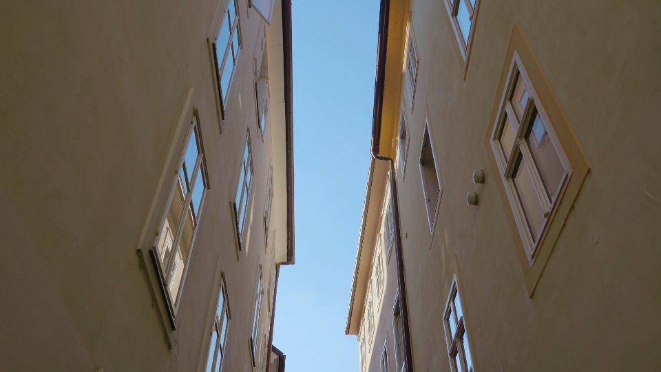 Narrow shady street with old buildings in Ljubljana center