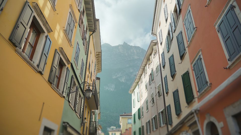 Old vintage buildings against giant forestry mountains