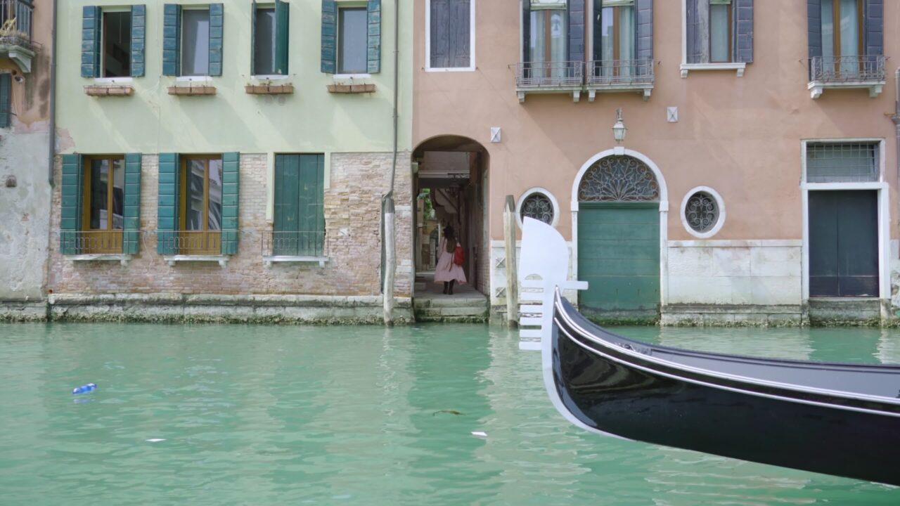 Woman walks through narrow passage after sailing on boat