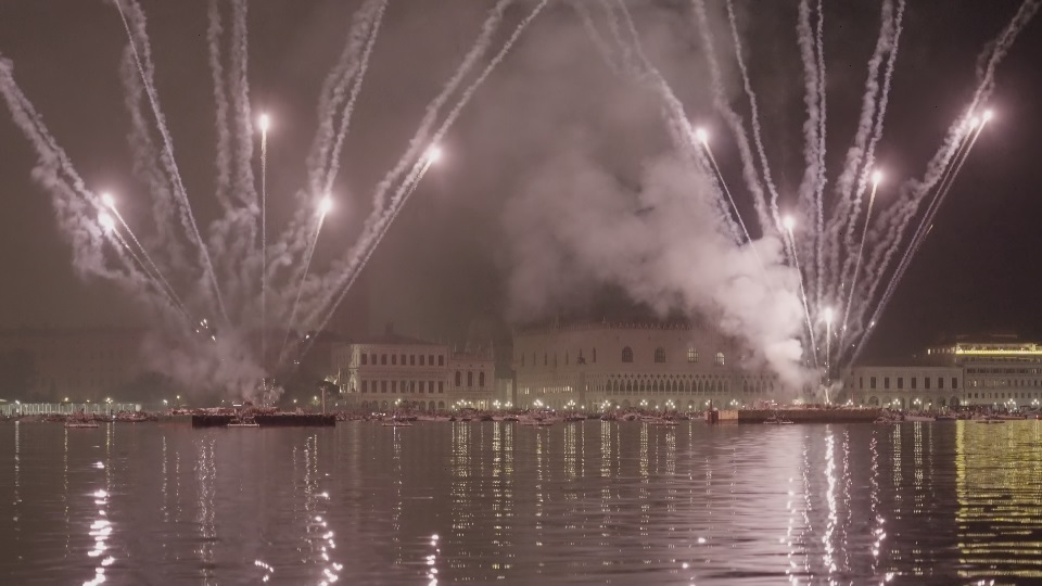 Bright fireworks launched in air spreading smoke over city