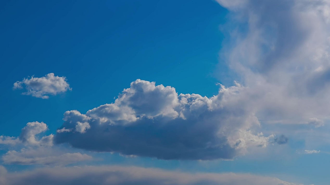 Blue clouds flow in timelapse in the sky