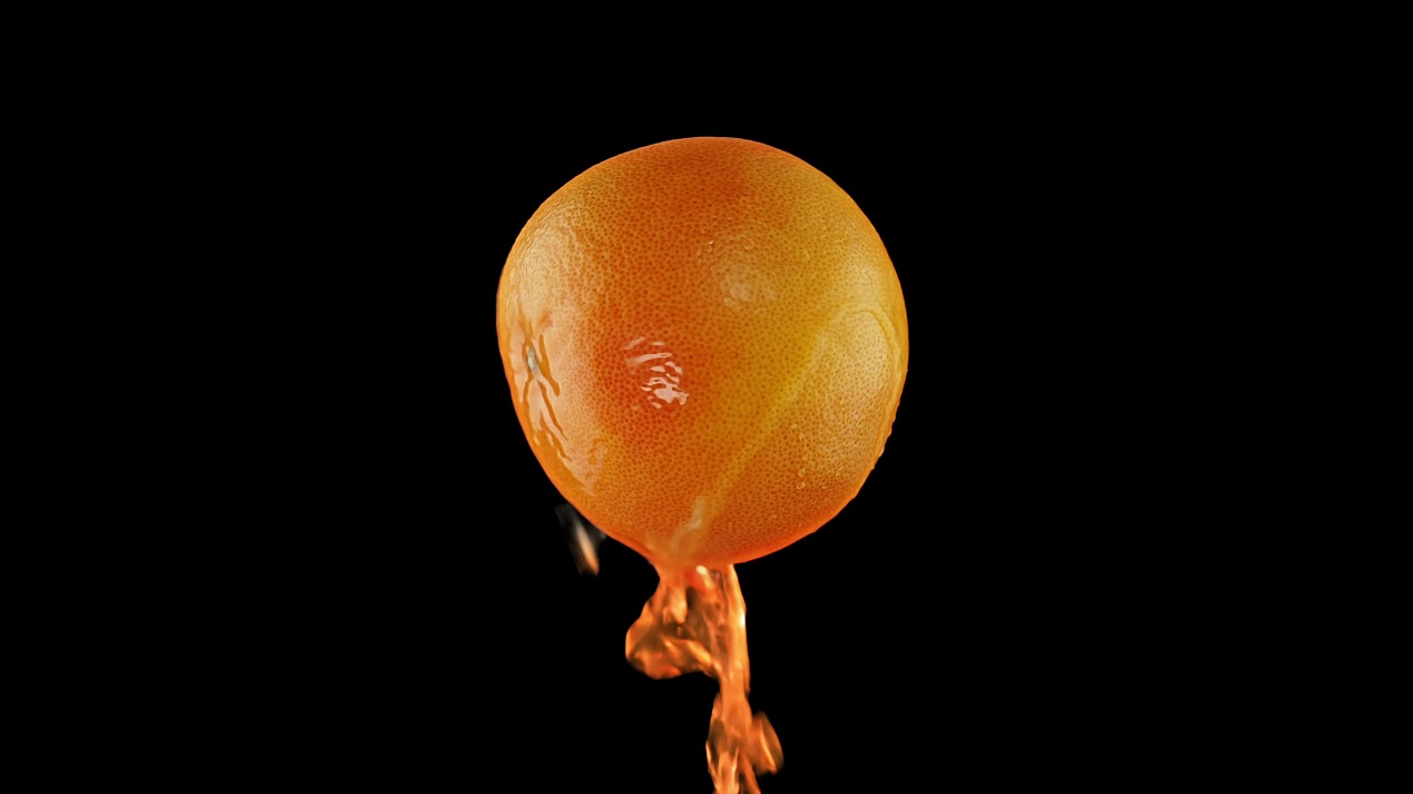 Juice flows from the round grapefruit on a black background