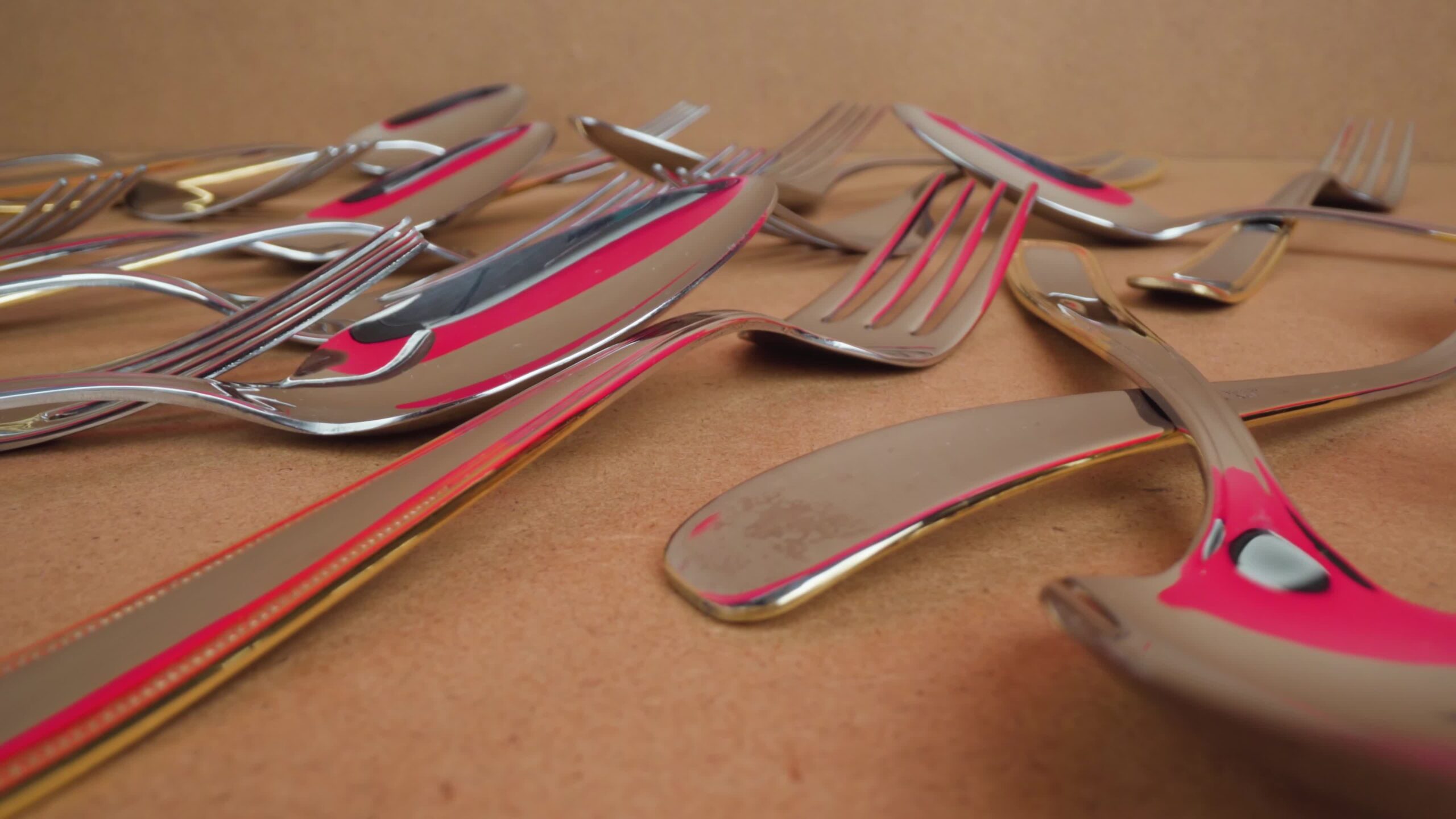 Stainless Steel Elegance: Stainless Steel Tableware Scattered in Cardboard Box