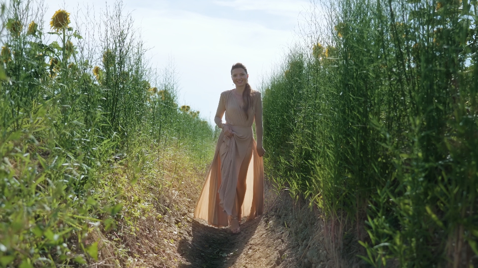 Elegant Stroll Amidst Lush Green Plants in Cultivated Field