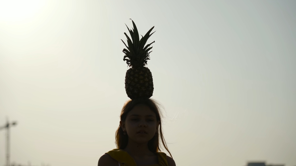 Teen hyenas on a pineapple head