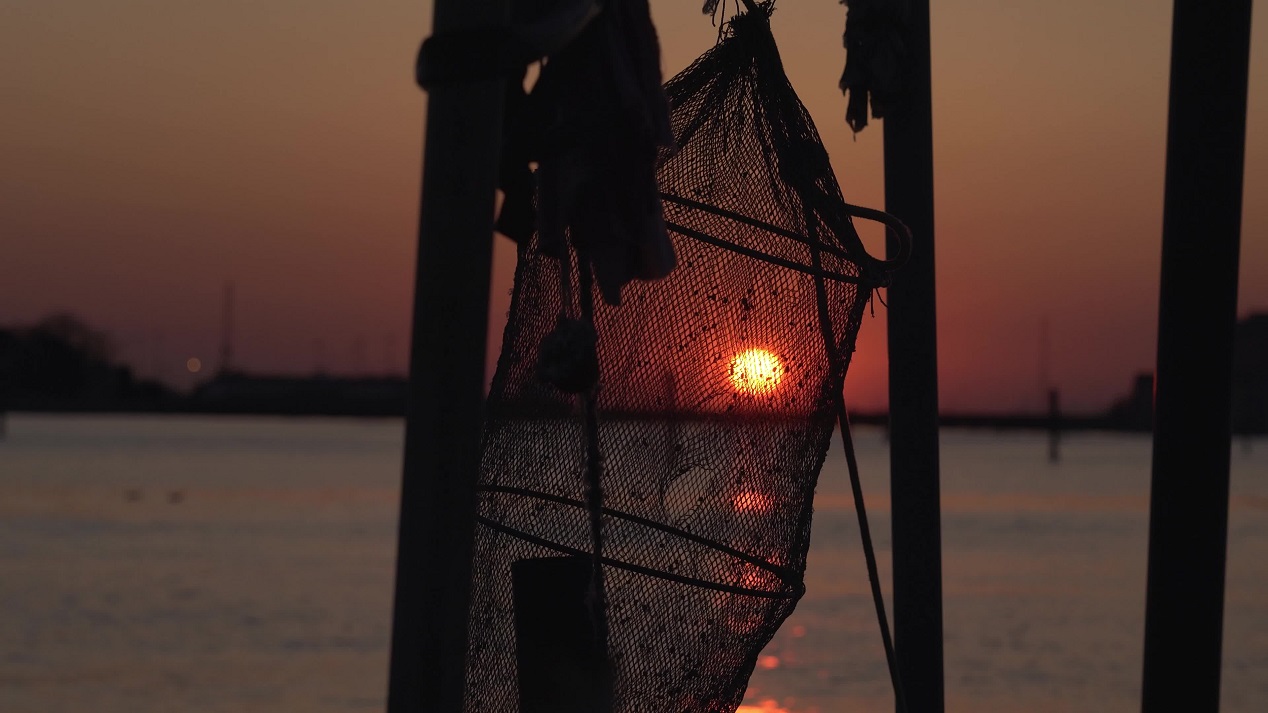 Fishing net hanging at sunset over the lagoon