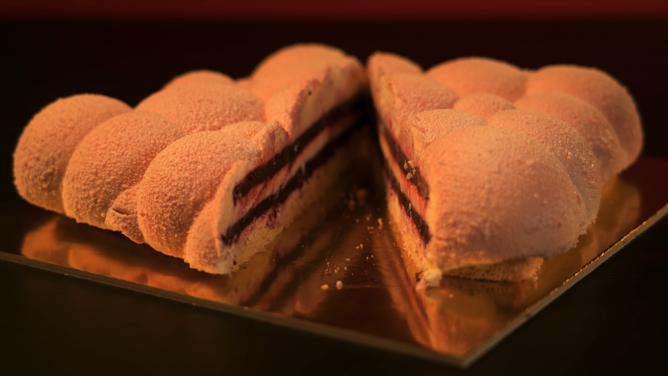 Stylish cake cut in two on the table