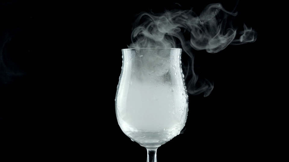 White smoke enters the glass goblet