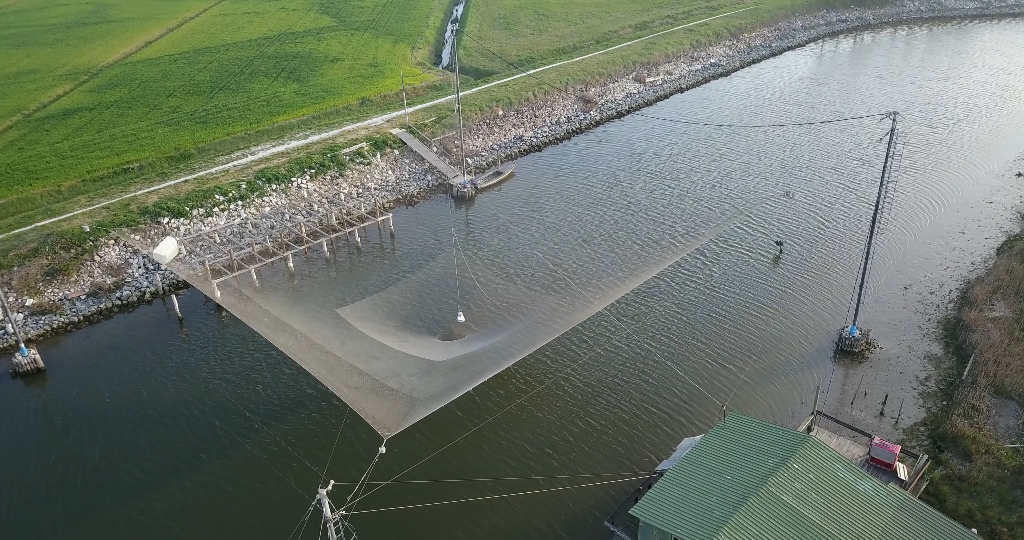 Aerial view of a fishing net above the river