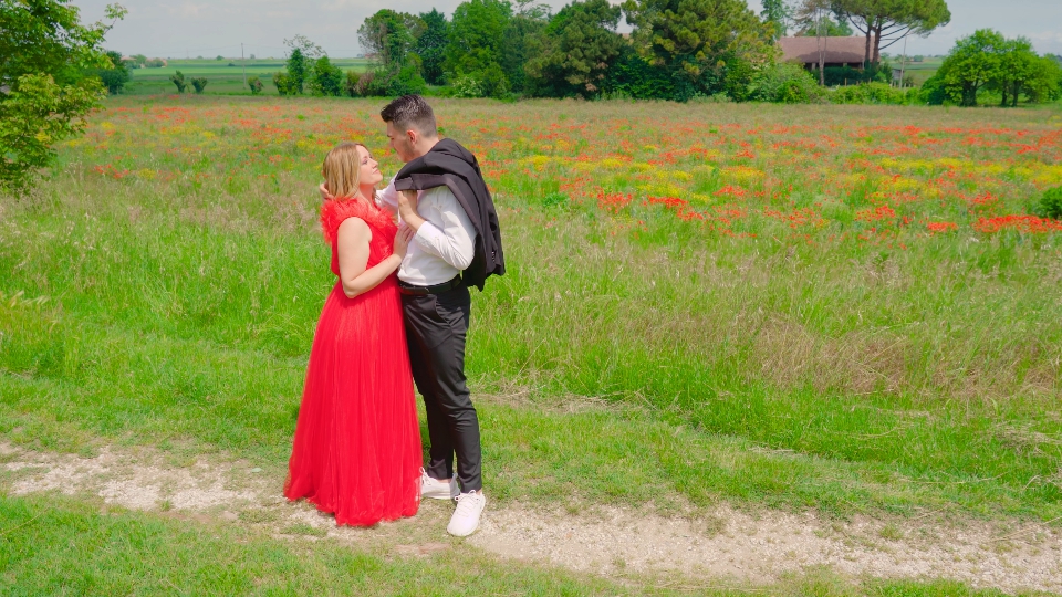 Two lovers with elegant clothes among nature