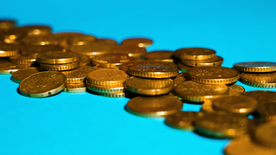 Euro coins on the blue floor