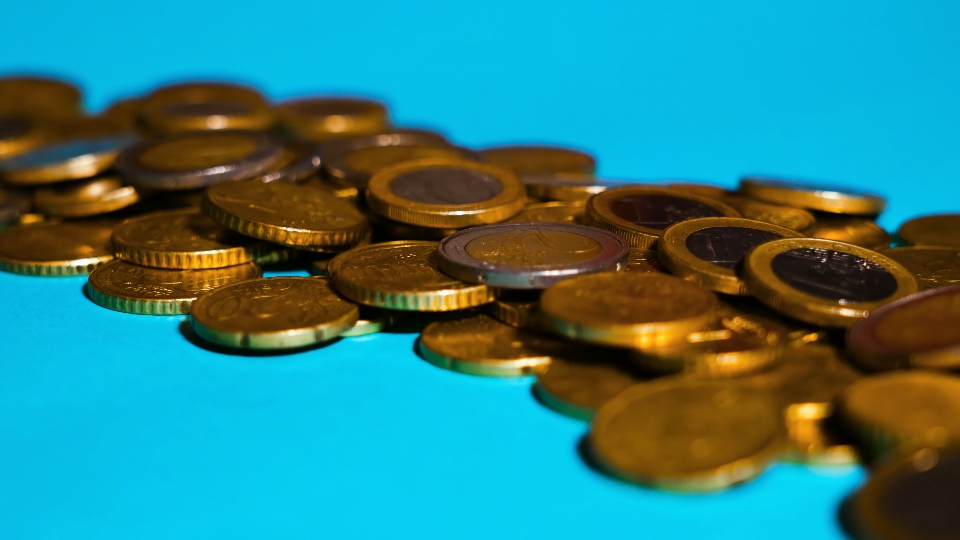 Euro coins on the blue floor