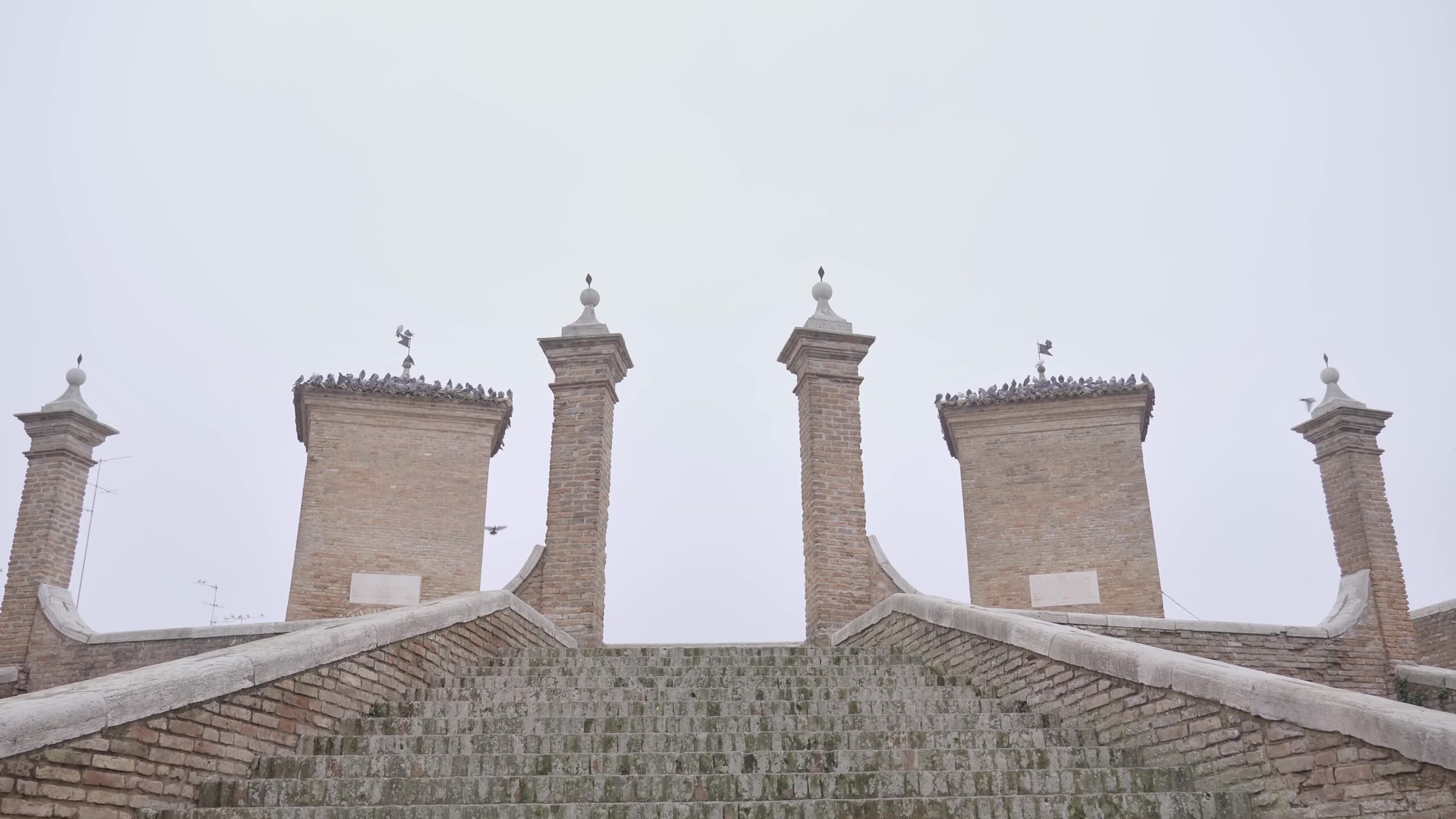 Climb the stairs to the ancient towers