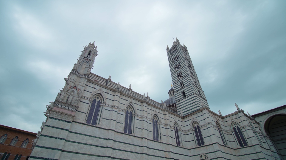 Facade with tower of an Italian Roman Gothic church