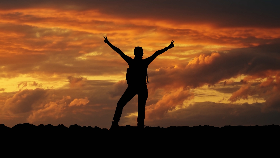 Mountaineer at beautiful sunset