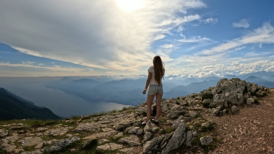 Woman walks above Garda lake – Timelapse