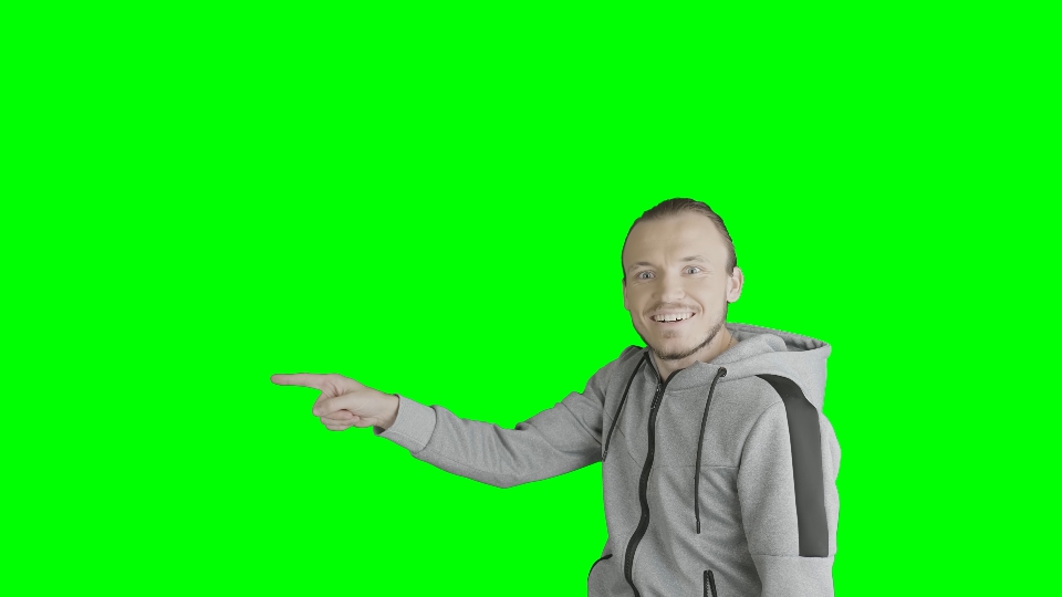 Man points  on the green screen