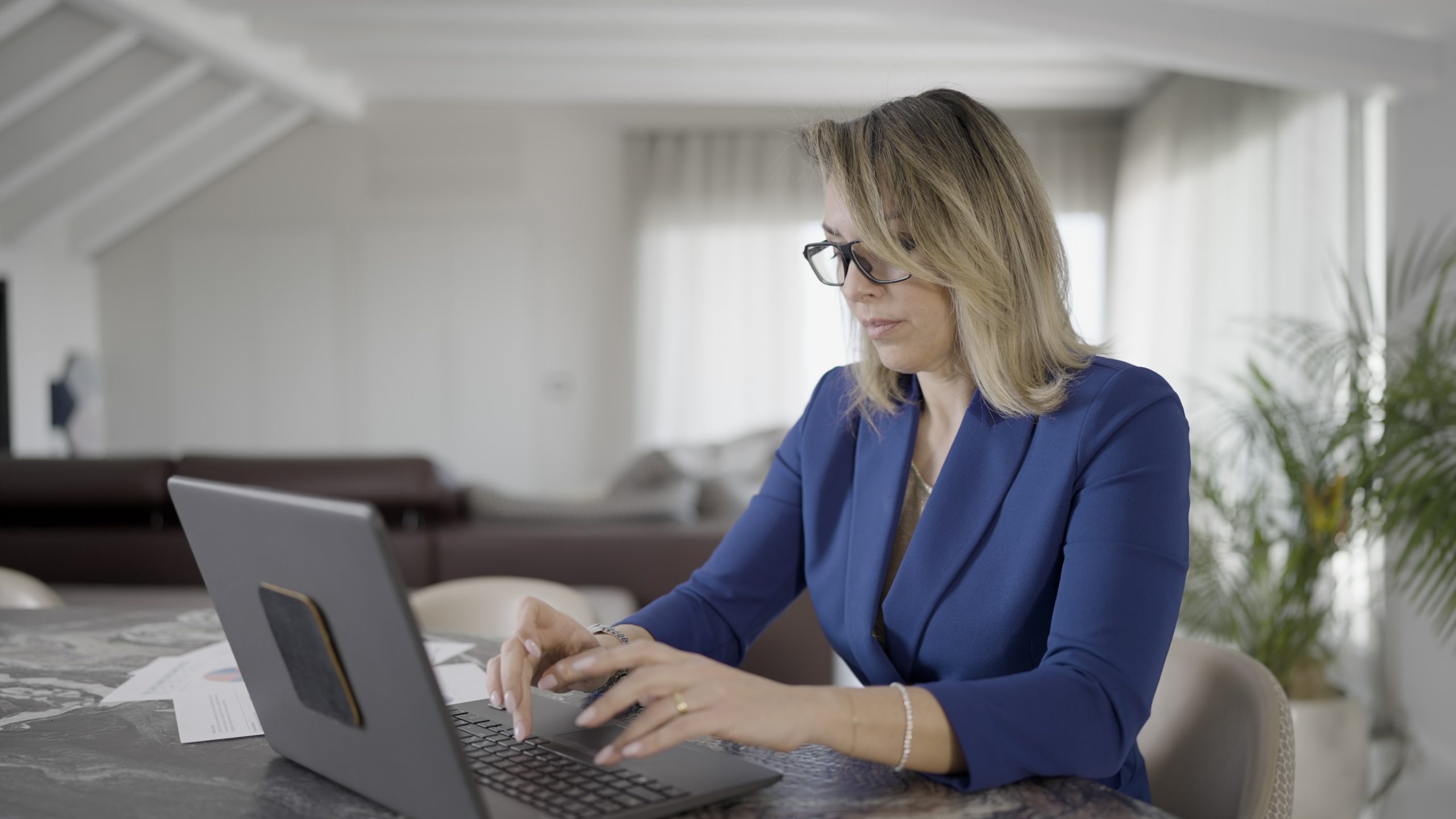 Serious woman works on the computer