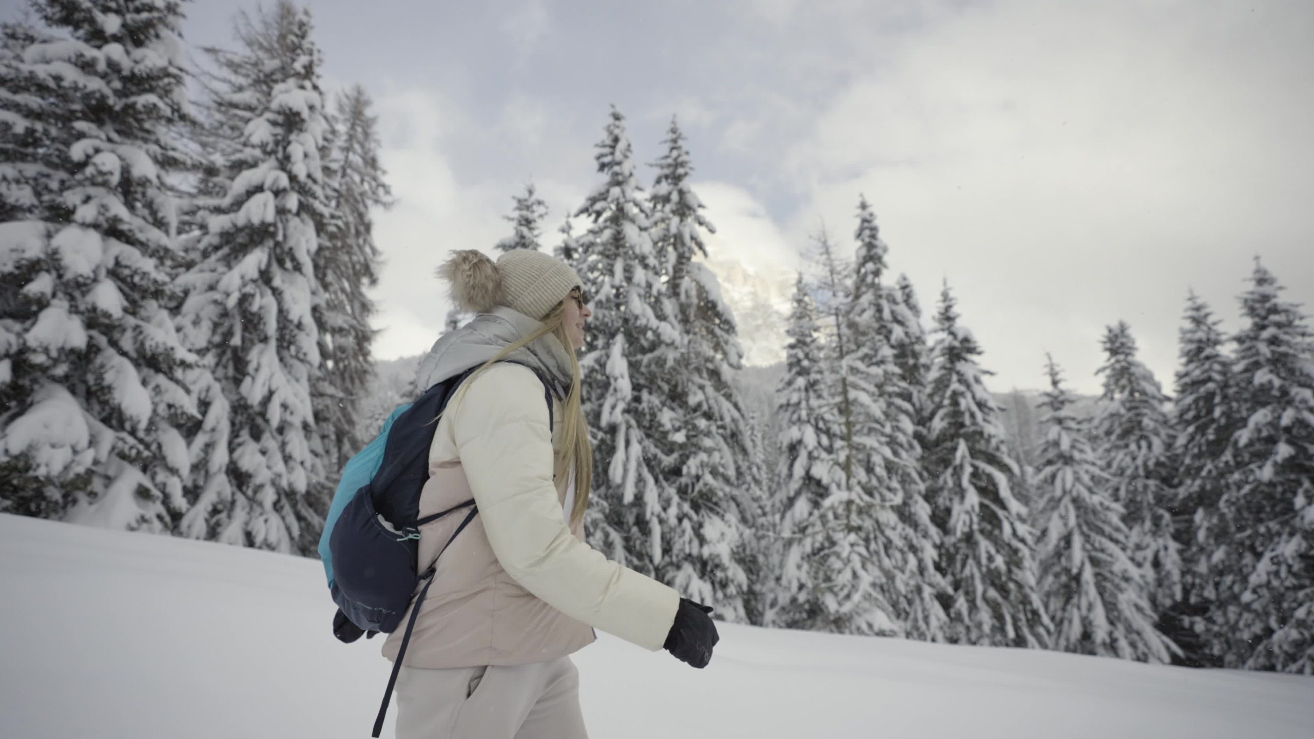 Woman with Backpack Sliding Down on Snow Covered Hiking Trail with  Panoramic View on Snowcapped Mountain Peak Kreiskogel Stock Photo - Image  of recreation, backpacker: 265315204