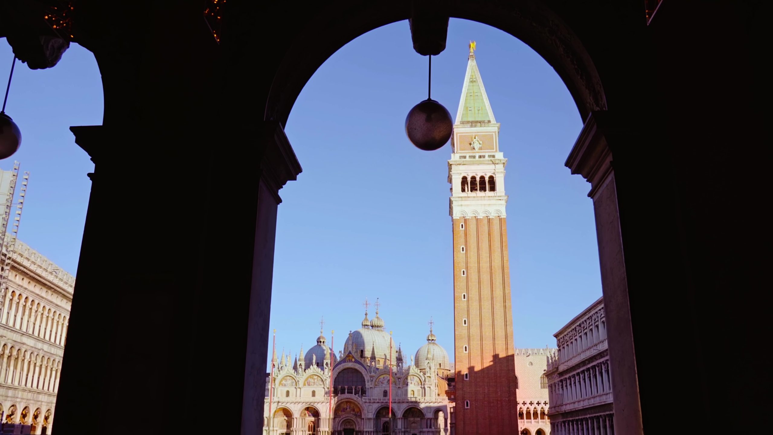 Movement towards the deserted Piazza San Marco with Basilica and Bell Tower