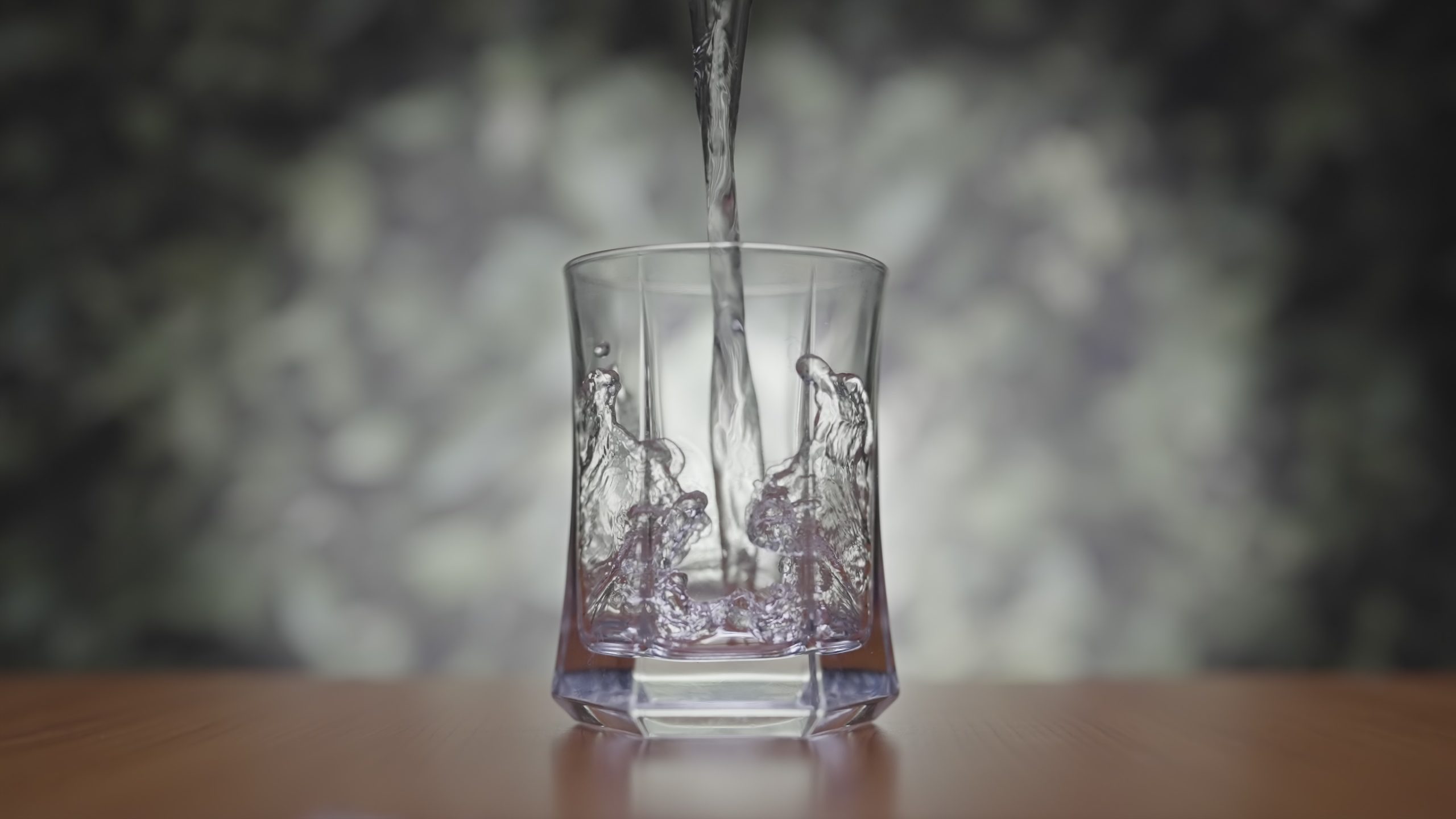 Water is poured into the glass cup