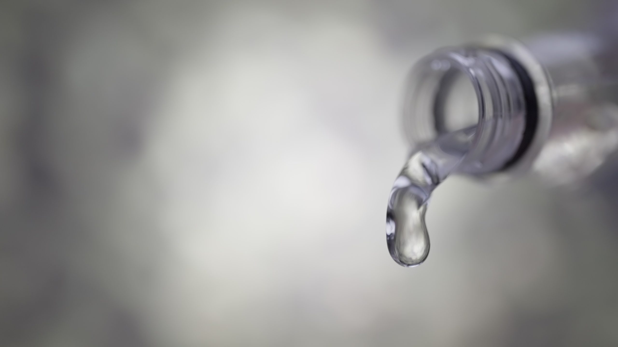 Water flow comes out of the bottle in slow motion