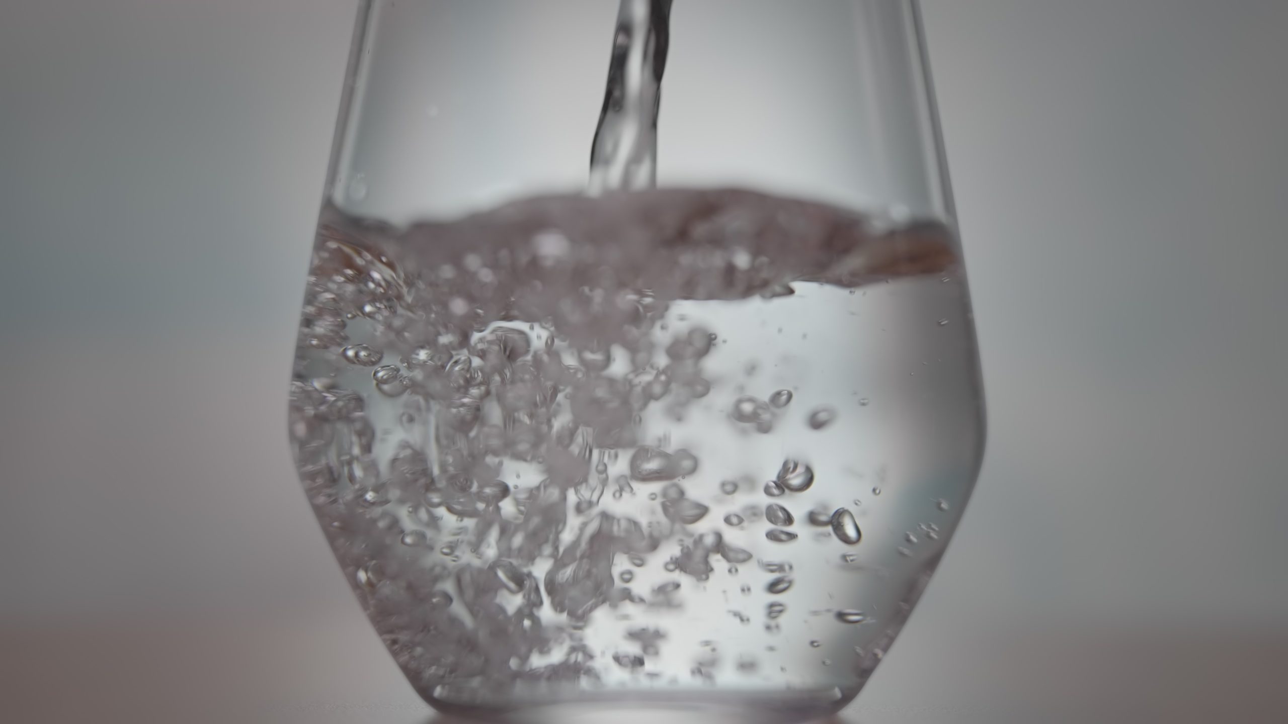 Water fills transparent glass