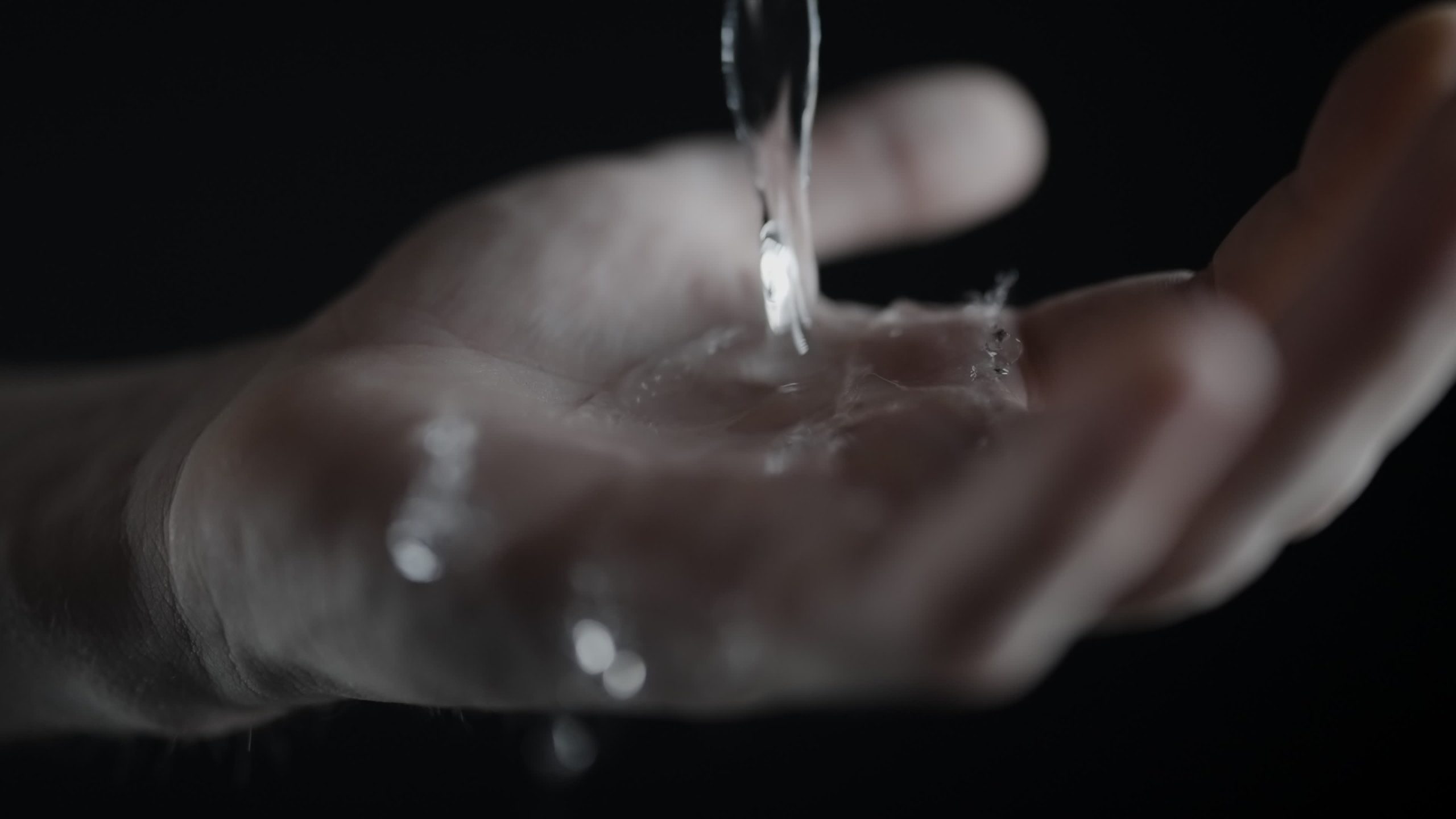 Water Flowing into an Open Hand