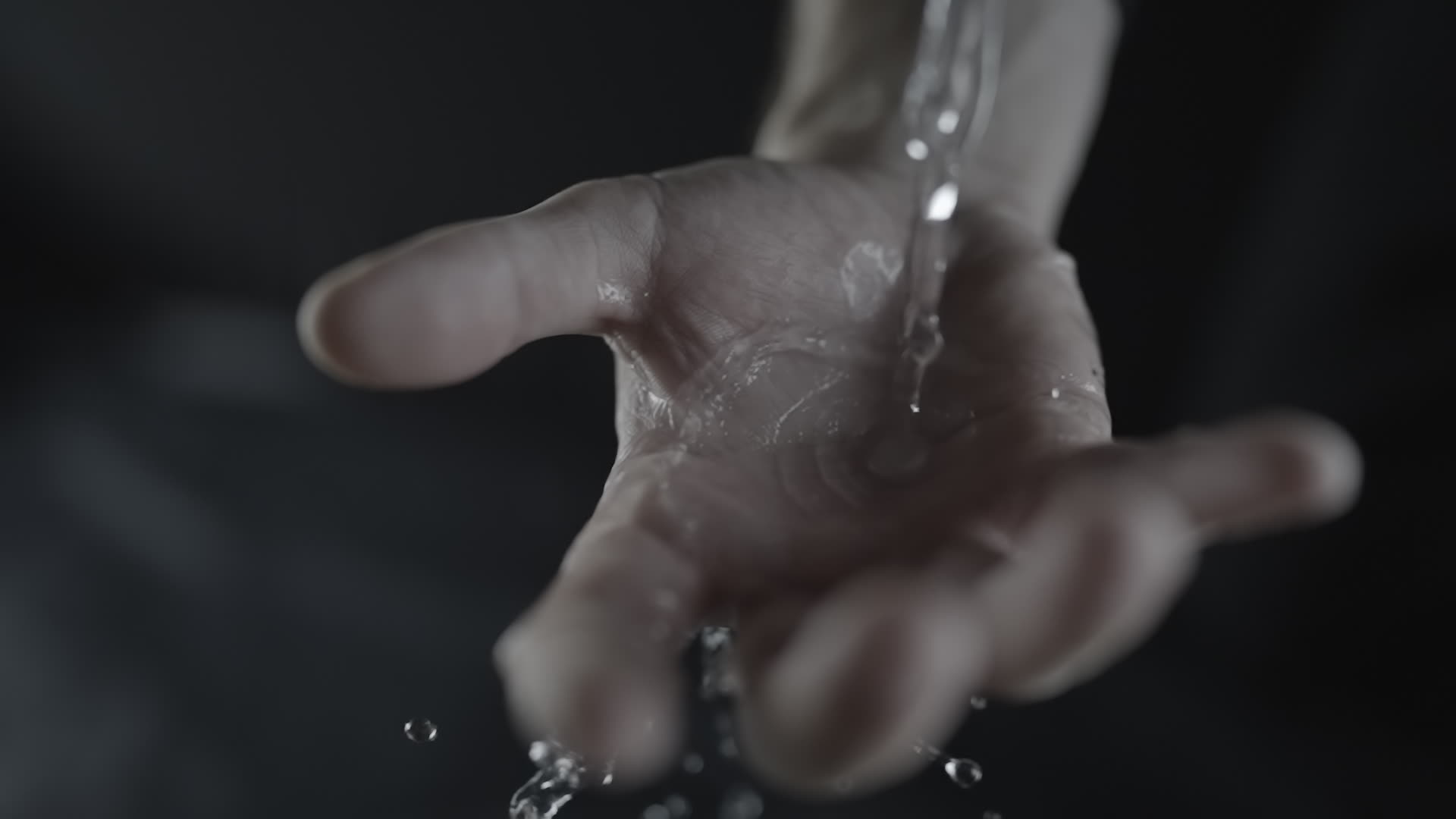 Water Flowing into Open Palm