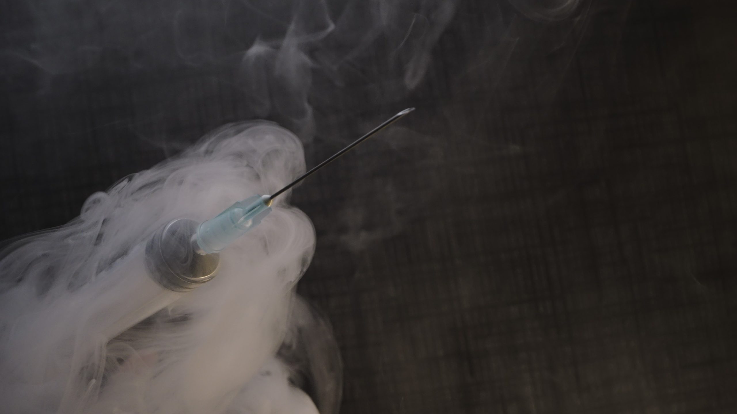 Syringe Shrouded in Smoke